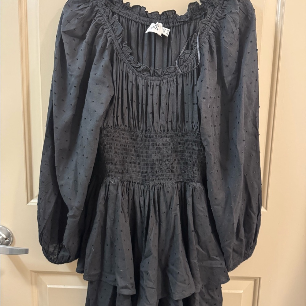 Black, tiered skirt romper with flowy sleeves